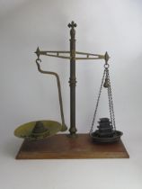 A Pair of Brass Balance Scales with modern weights, 61cm tall