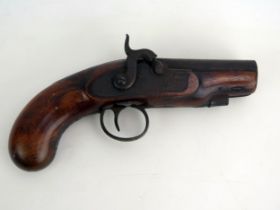 A mid 19th century percussion 3/4ins bore pistol, with 9cm fully stocked barrel, walnut grip,