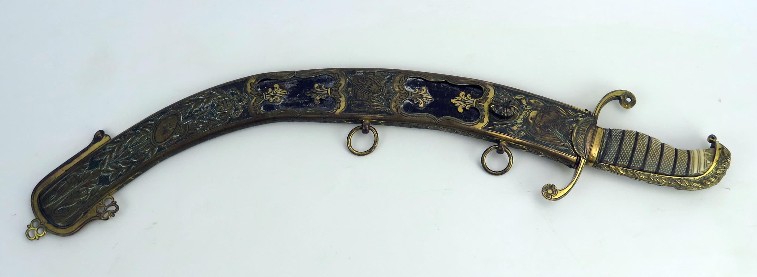 An early 19th century continental cutlass, with 44cm curved and etched blade, with gilt brass