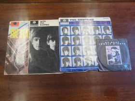 A Collection of Beatles LP Records and Paul McCartney single