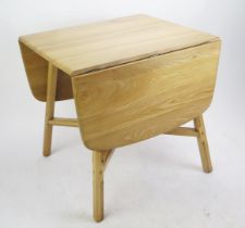 An Ercol Stripped Oak Kitchen Lap Table, 75(w)x 65-138(l)x72(h)cm