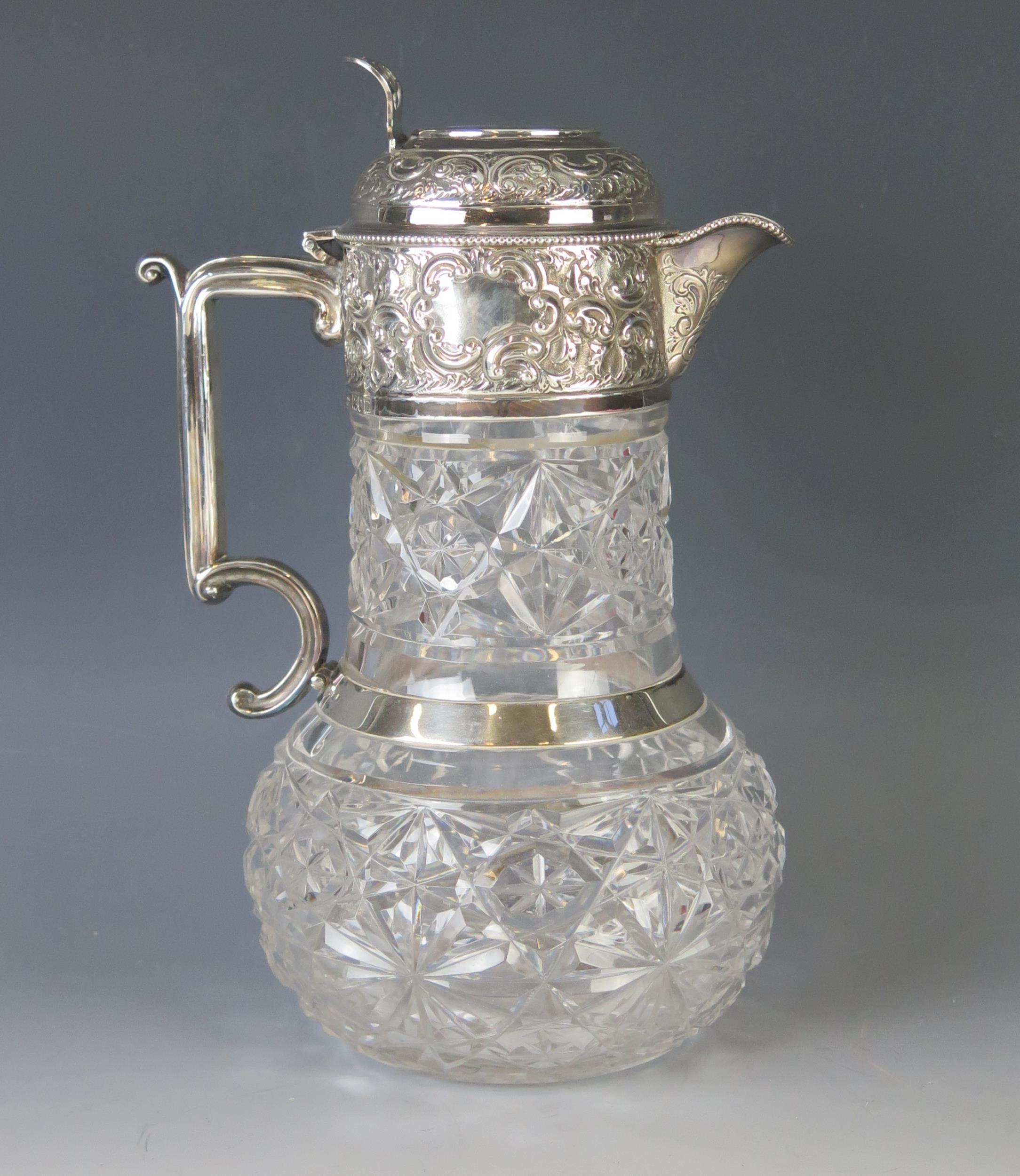 An Edward VII clear glass and silver mounted claret jug, maker Goldsmiths & Silversmiths Co Ltd,