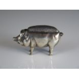 A silver novelty pin cushion in the form of a pig, all marks worn and rubbed, 5.5cm long, 32gms, 1.