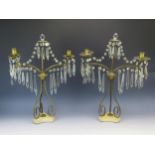 A pair of 19th century gilt metal twin branch candelabra, with glass prismatic suspensions,