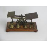 A Set of Early Brass Postal Scales with a set of Victorian brass weights