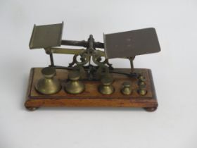 A Set of Early Brass Postal Scales with a set of Victorian brass weights