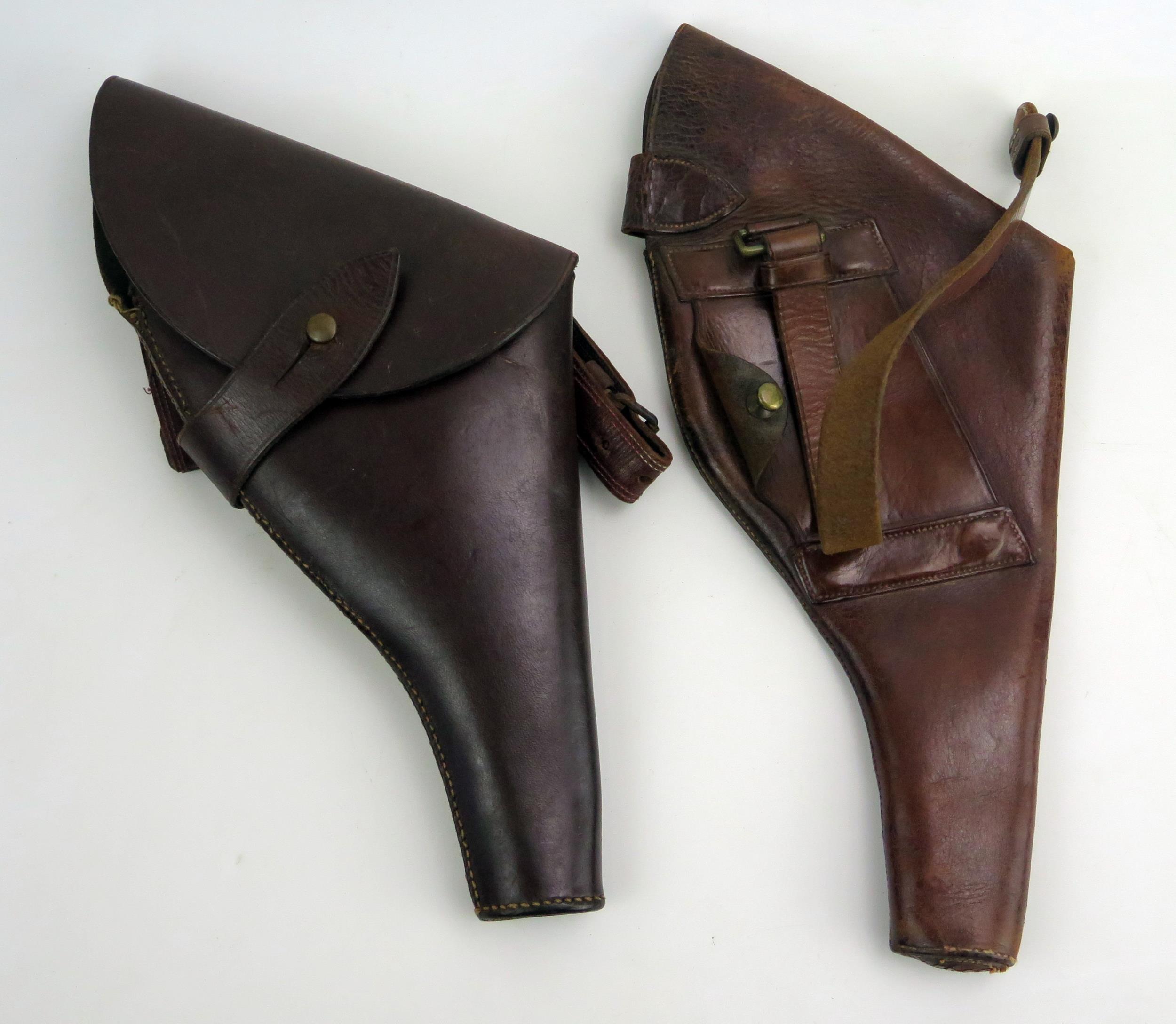 A World War One period, British Army Officer's leather Webley holster, together with another similar