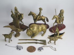 A Collection of Brass Ornaments including a bison, two American First Peoples and cowboy on