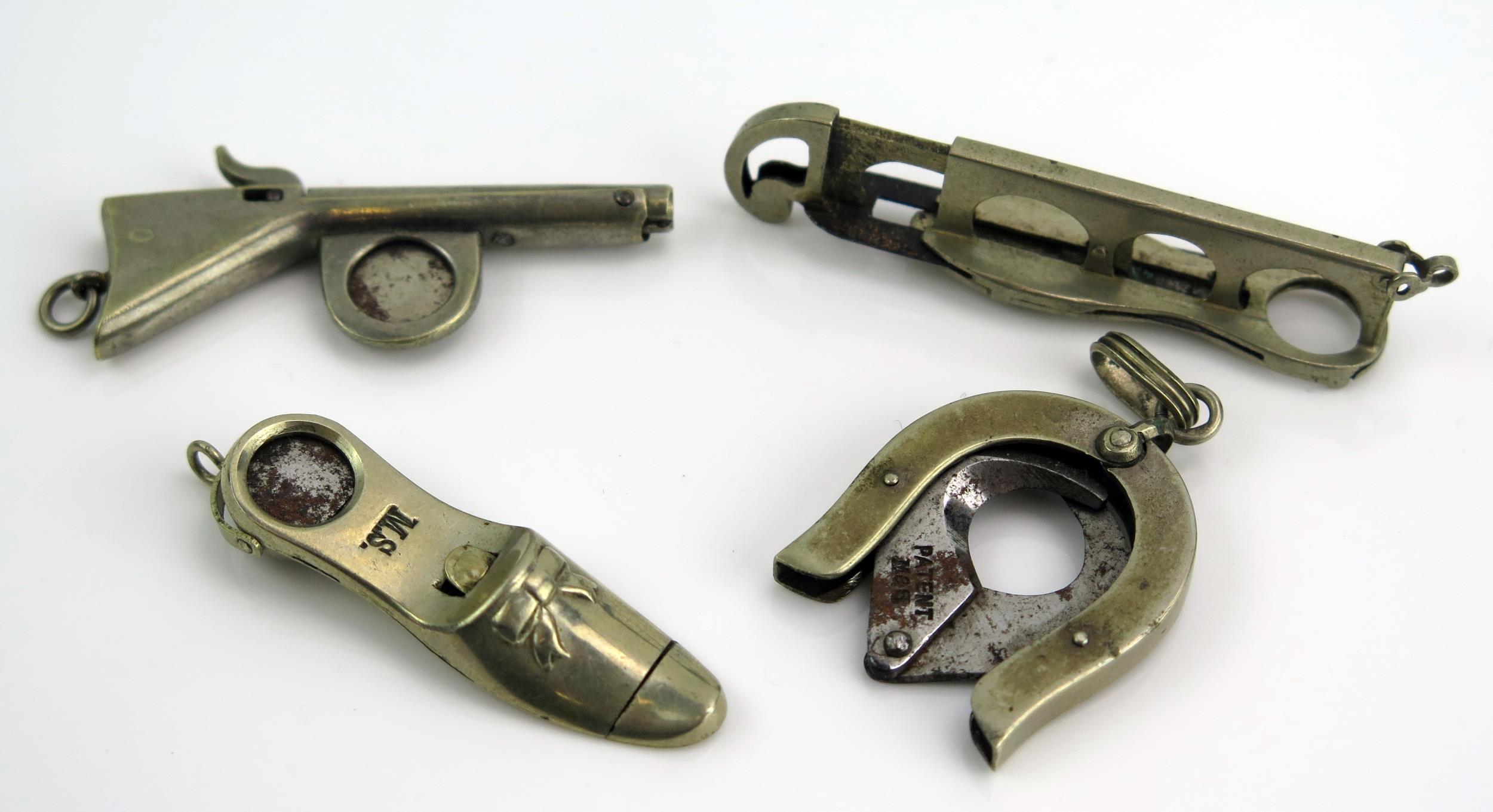 A Halifax Patent Cigar Cutter, a shoe shaped cigar cutter (M.S.), one in the form of a rifle and