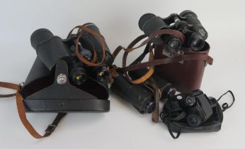 A pair of Pentax 7 x 50 binoculars contained in a leather carrying case, a pair of 8 x 40