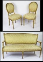A Louis XVI style part salon suite includes canapé and two side chairs, the canapé with curved top