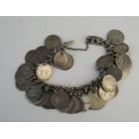 A silver coin bracelet, 15cm long with safety chain, 67gms, 2.16ozs