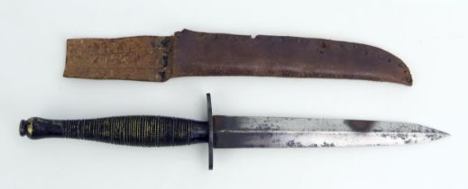 A Fairbairn-Sykes fighting knife, third pattern, with 16cm double edged blade, ribbed grip,