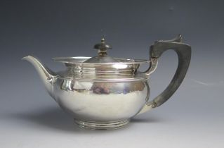 A George v silver teapot, maker Elkington & Co, Birmingham, 1919, crested, of plain circular form,