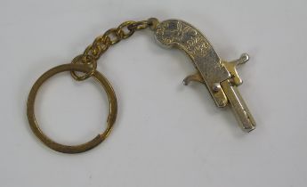 An early 20th century miniature pistol, obsolete calibre, 4cm long.