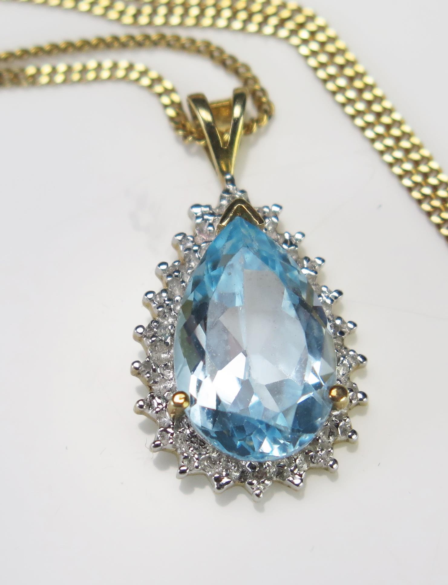 A Blue Topaz Tear Drop Pendant (24.3mm drop) on an 18" (46cm) 9ct gold chain, hallmarked, 2.57g - Image 2 of 2