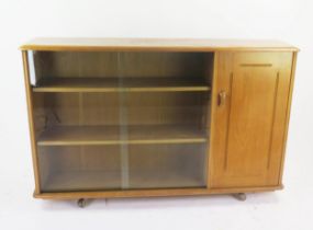 A Priory Bookcase with a single cupboard, 136(w)x35(d)x87(h)cm
