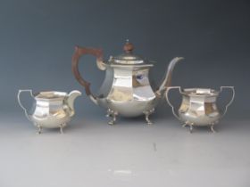 An Edward VII silver three-piece tea service, maker Adie Brothers Ltd, Birmingham, 1902, of squat