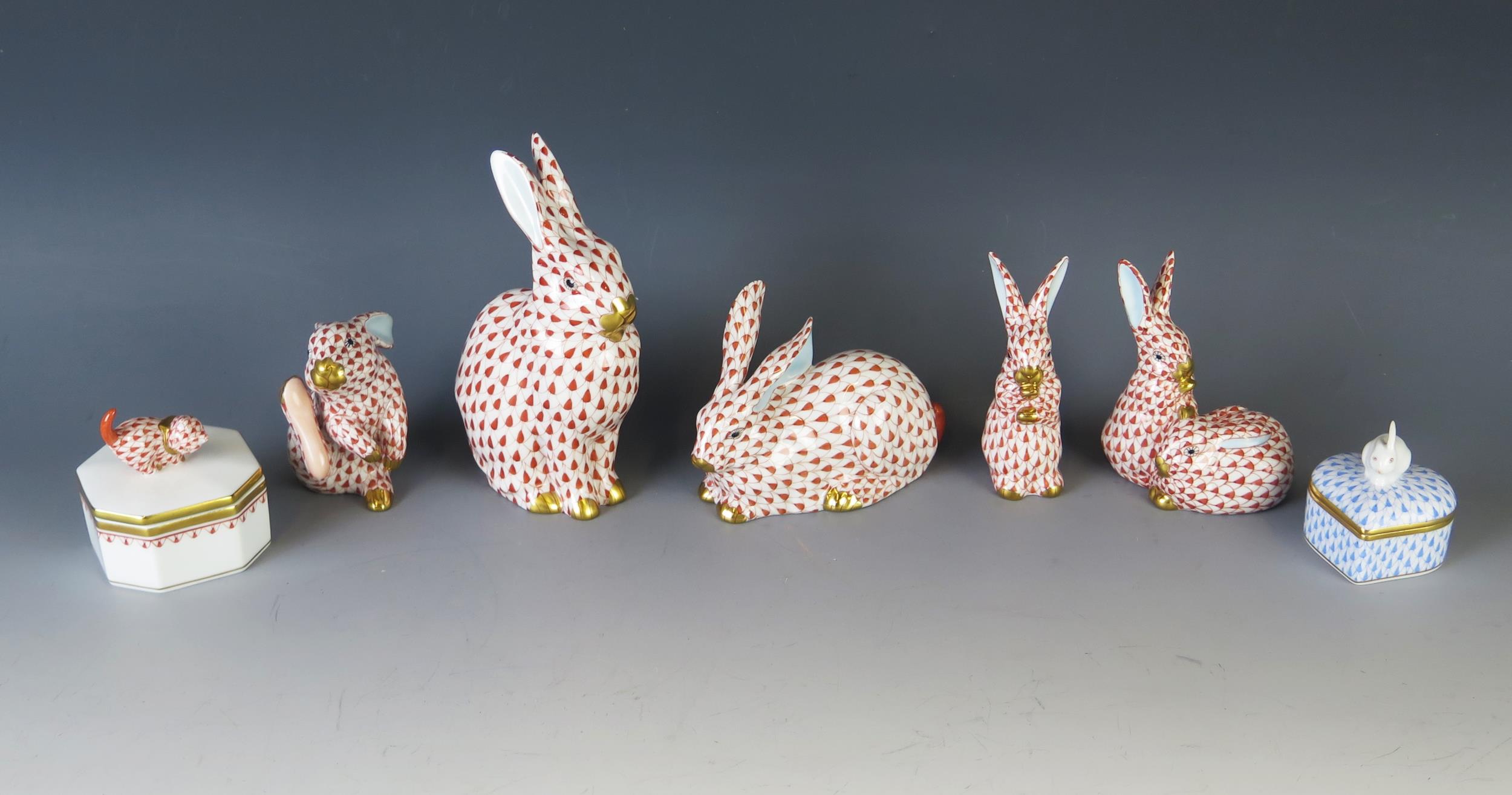 A collection of Herend porcelain models of rabbits, the largest 14cm high, together with two