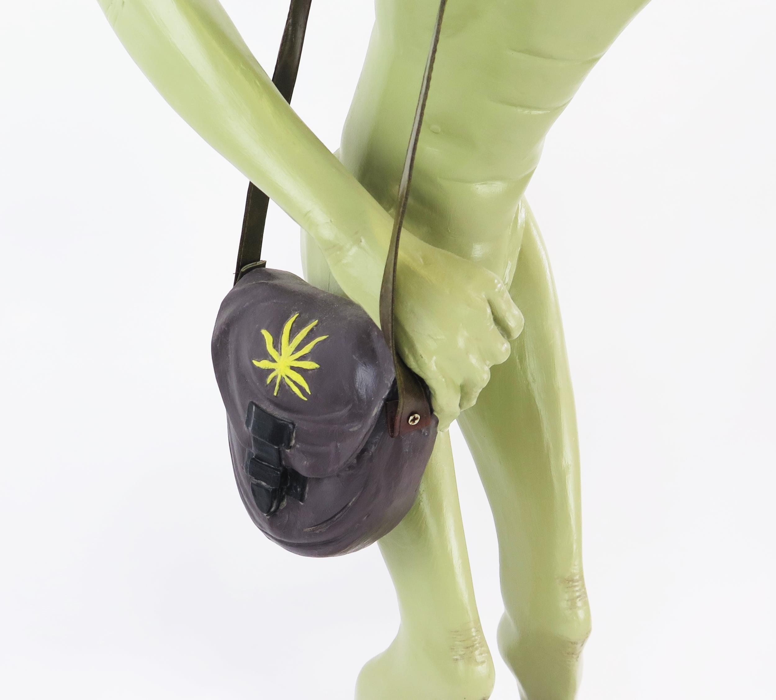 Life Size Alien Resin Figure with shoulder bag and hat decorated with yellow hemp, figures held to - Image 3 of 5