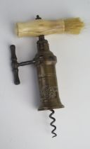 A 19th century brass Thomason King's screw type mechanical corkscrew, with turned bone handle,