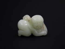 A Chinese Carved Jade Figure of a baby, c. 4.5cm long