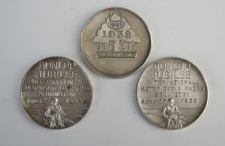 Three post War silver Dunlop motorcycle medallions, 58gms, 1.88ozs