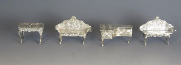 A collection of silver miniature furniture, various makers and dates, includes spinet, sofas, 72gms,