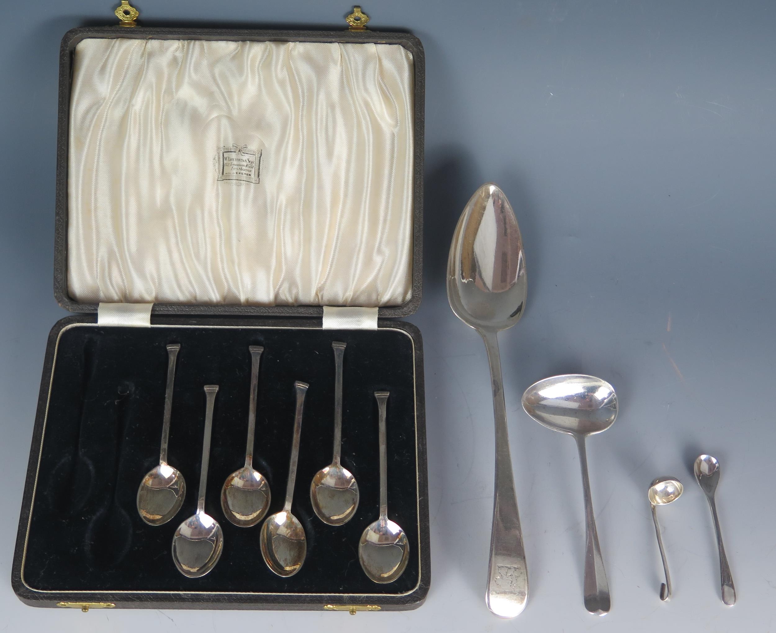 A mixed collection of silver flatwares, includes George III Old English pattern tablespoon, crested,