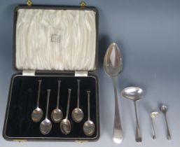 A mixed collection of silver flatwares, includes George III Old English pattern tablespoon, crested,