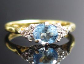 An 18ct Gold, Aqua Marine and Diamond Ring, size J.5, hallmarked, 2.48g