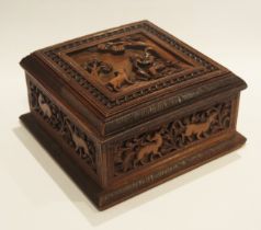 An Anglo-Indian (Mysore) carved sandalwood casket, of square outline, the hinged lid decorated with