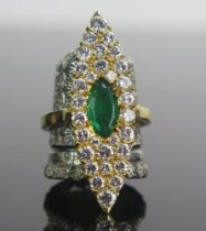 An Emerald and Diamond Marquis Ring in a precious yellow metal setting 35.2x11.7mm head, size K.