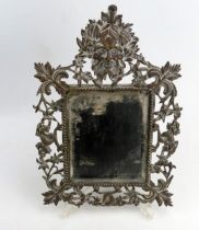 A 19th Century Continental Cast Brass Wall Mirror with a pierced frame decorated with a green man