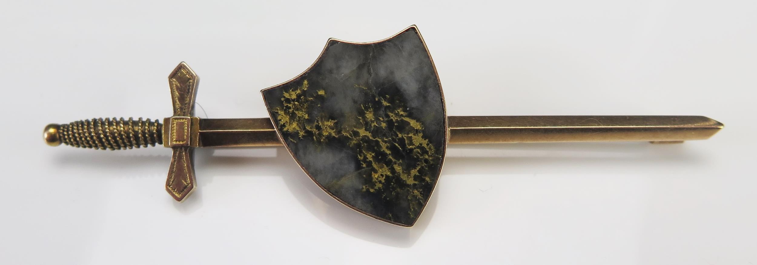 A Goldstone Shield and Sword Precious Yellow Metal Brooch, 85.5mm long, KEE tests as 15ct, 11.68g.