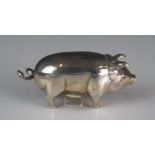 An Elizabeth II silver novelty tape measure in the form of a pig, maker C M E Jewellery Ltd,