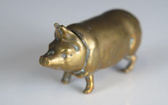 A brass novelty vesta case in the form of a pig, 4.5cm long