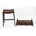 A mahogany luggage stand, of rectangular form with slatted top and raised on four square legs,