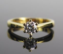 An 18ct Yellow Gold and Diamond Solitaire Ring, 5.11mm claw set brilliant round cut, size M.5,