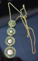 A 9ct Gold, Diamond and Precious Green Stone Pendant on chain, 76.4mm drop, 22.4mm diam. lower '