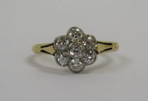 An Antique 18ct Gold and Diamond 'Daisy' Cluster Ring, c.2.8mm old cut millegrain set stone, size