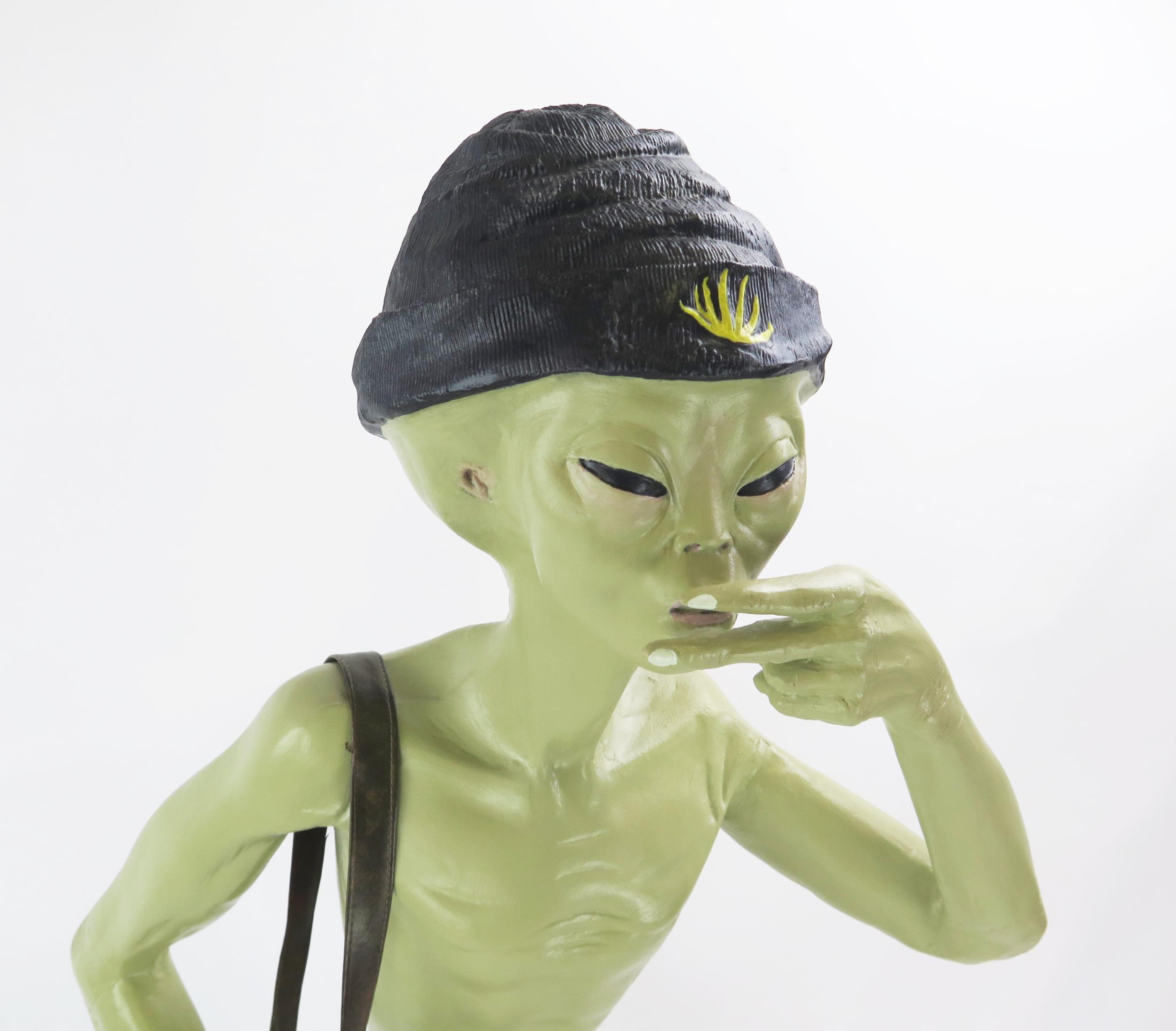 Life Size Alien Resin Figure with shoulder bag and hat decorated with yellow hemp, figures held to - Image 2 of 5
