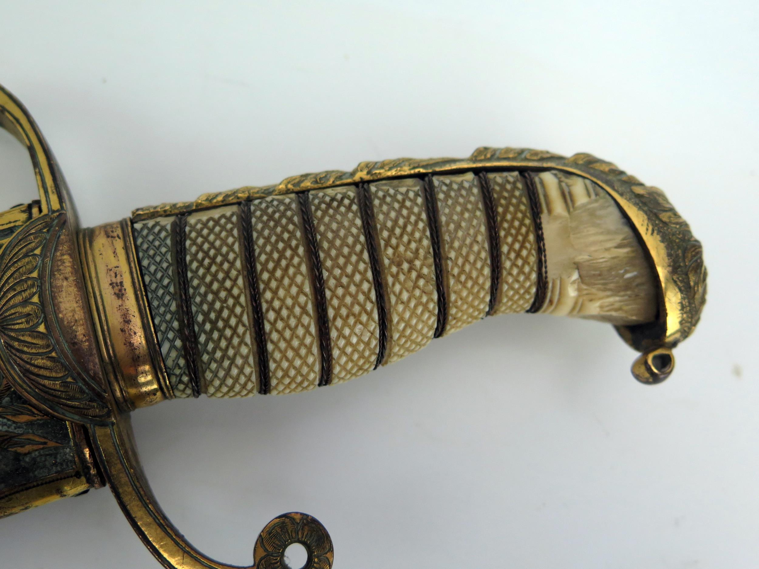 An early 19th century continental cutlass, with 44cm curved and etched blade, with gilt brass - Image 10 of 15