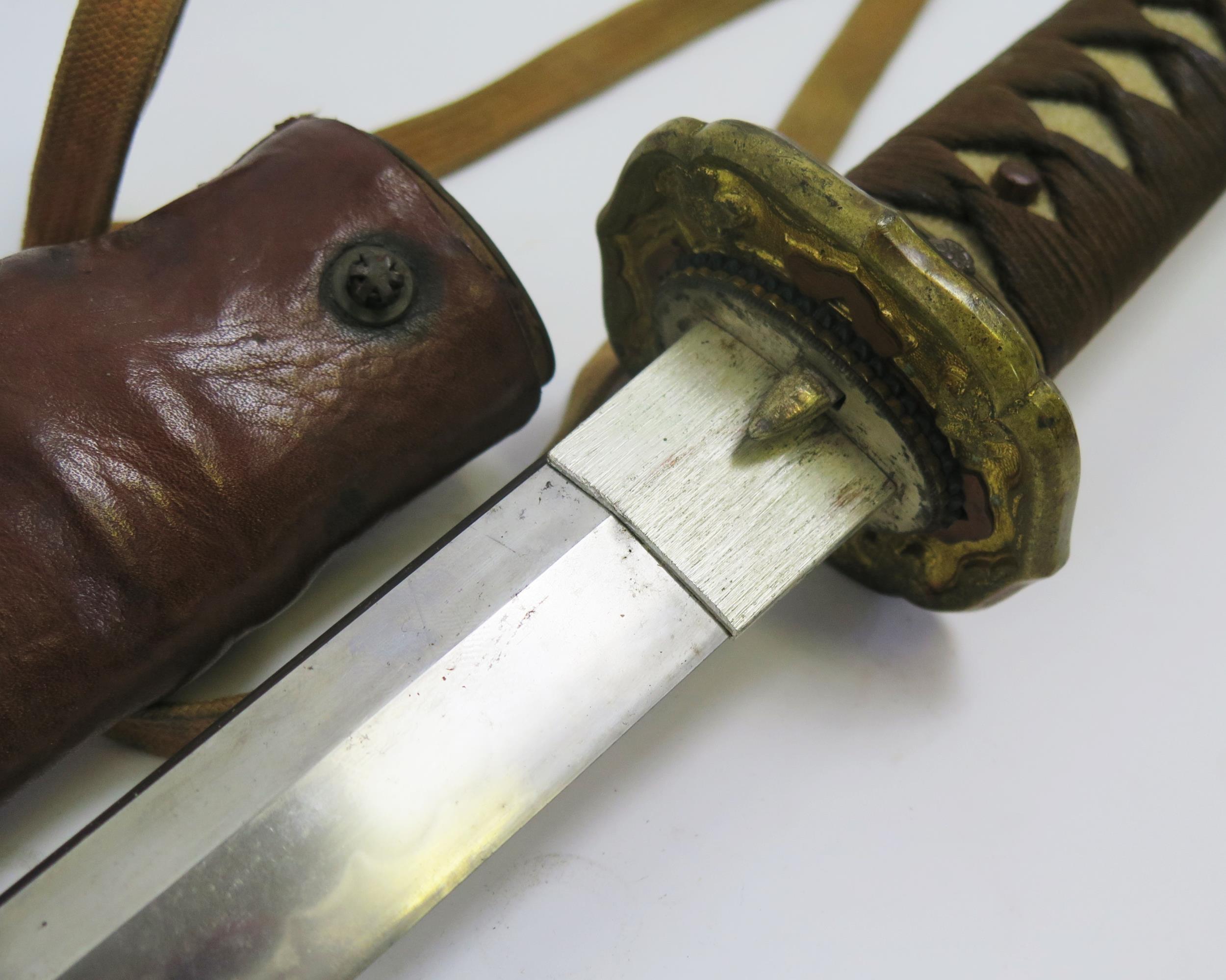 A Japanese World War II officers katana, with 63cm signed blade with bronze tsuba with cherry - Image 3 of 5