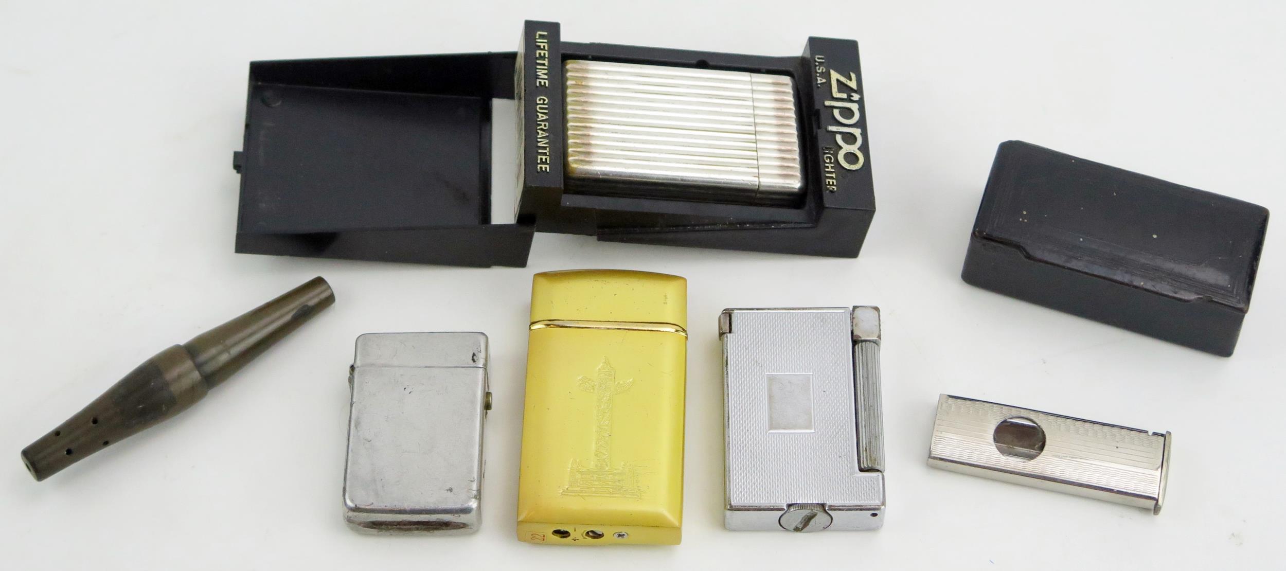 A Dunhill Silver Plated Model 466087 Sprit Lighter and others, etc.
