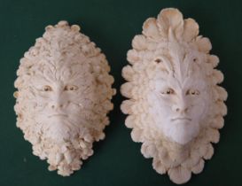 A composite marble wall appliqué of "The Green Man" and "The Green Woman", 36cm and 39cm high.