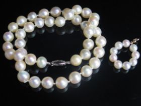 A 17.25" (44cm) Cultured Pearl Necklace with 9ct white gold clasp and a pearl pendant with 9ct