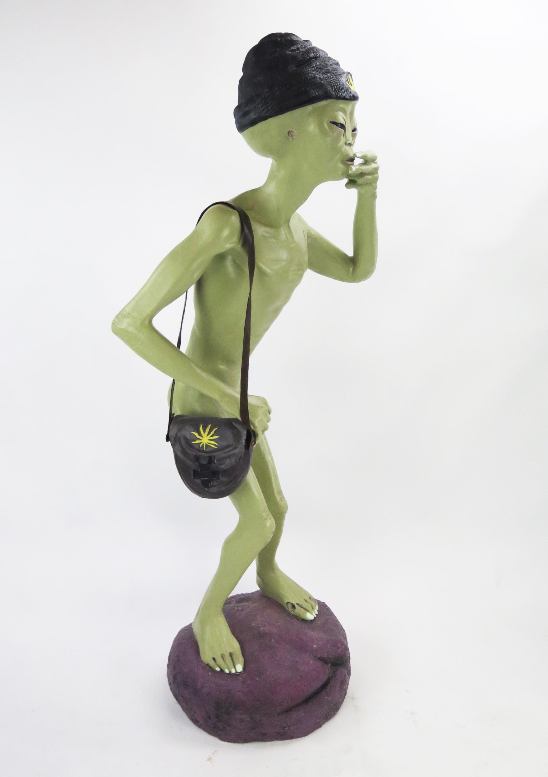 Life Size Alien Resin Figure with shoulder bag and hat decorated with yellow hemp, figures held to - Image 4 of 5