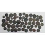 A sheet containing approximately 54 base metal Roman coins