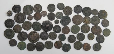 A sheet containing approximately 54 base metal Roman coins